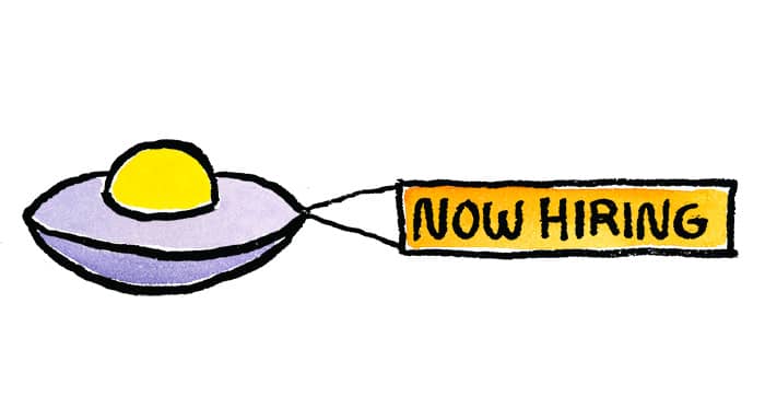 A UFO pulling a now hiring banner