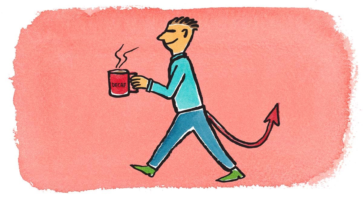 an employee with a devil tale and a red cup of decaf coffee